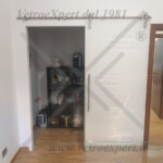 porta in vetro extra chiaro con carrucola acciaio