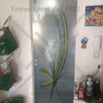 porta in vetro satinato decorata con carrucola acciaio